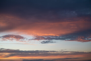 Colorful cloudy sky at sunset. Beautiful color transitions. Abstract background of nature.