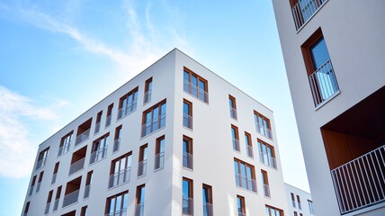 Estate property and condo architecture. Fragment of modern residential flat with apartment building exterior. Detail of new luxury home complex. 