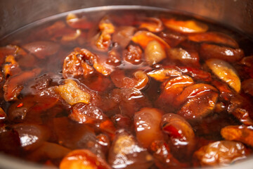 
Ready-made freshly brewed apple jam in a saucepan and stainless steel.Side view