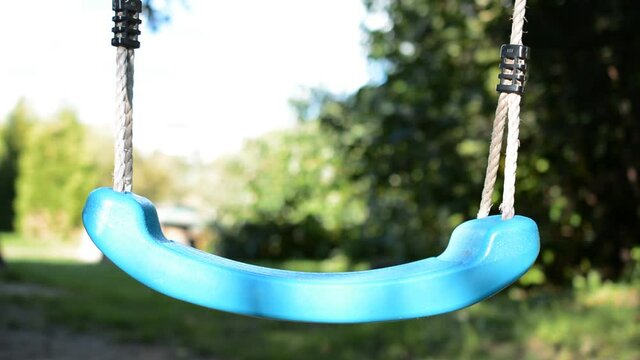 Empty playground, emty children swing, no people