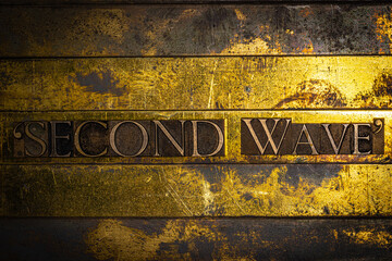 "Second Wave" text message on textured grunge copper and vintage gold background
