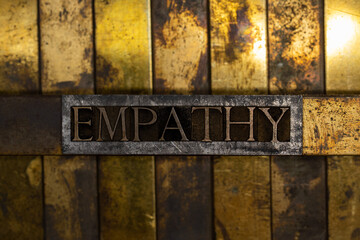 Empathy text message on vintage textured grunge copper and gold background