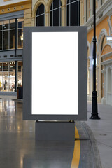 Empty billboard inside the mall, next to the shop windows. Mockup.