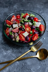 Greek salad on grey surface