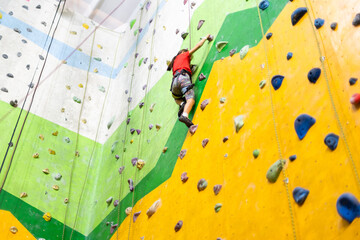 Little Girl Climbing Rock Wall