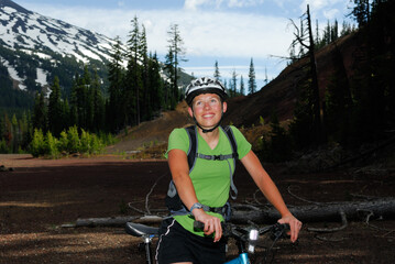 Female mountain biker taking a break near Mount Bachelor