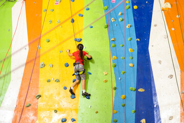 Little Girl Climbing Rock Wall
