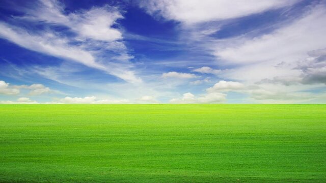 Time lapse 4K. 29.97FPS. Footage, Beautiful Green grass field and blue sky with bright sun summer landscape background