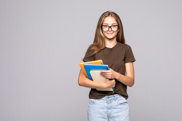 Young woman student with a book isolated on white background.