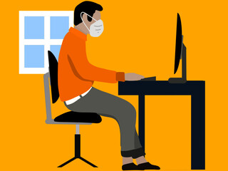 Person who is working in an office with his mask to protect himself from the coronavirus