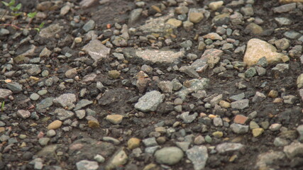 stones background, background of preparation of works for a paving, stones near the road, exactly lined stone and gravel before construction, a basis for construction
