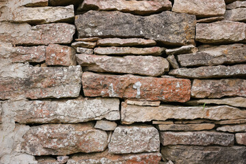Old stone wall texture background. The stone wall texture background natural color.