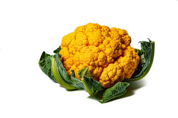 A yellow cauliflower head lies on a white background. Isolated