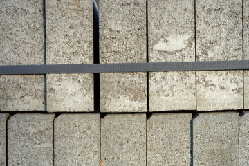 Pallet with concrete curbs for sidewalk construction