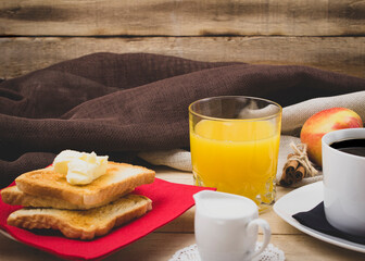 Fresh orange juice and black coffee with milk