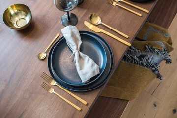 rustic table setup with brass cutlery