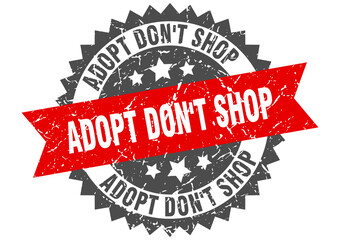 Obraz premium adopt don't shop stamp. grunge round sign with ribbon