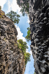 Basalt rocks and pristine water of Alcantara gorges in Sicily, Italy