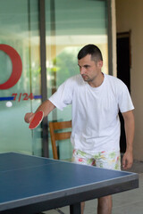 man playing ping pong game