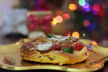 Christmas cake or King's Cake with christmas tree on the background