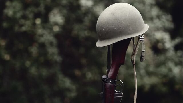 World War era M1 helmet and rifle