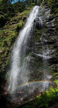 Picturesque summer Yalyn waterfall, higest waterfall in Ukrainian Carpathian Mountains, Marmaros. Beatiful rainbow in water streams and water dust. High resolution multishot stitched image.
