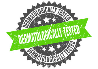 dermatologically tested stamp. grunge round sign with ribbon