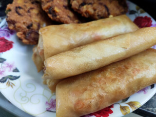 Popiah or spring rolls are cooked using hot cooking oil and presented to eat.. It comes with a variety of filling.  