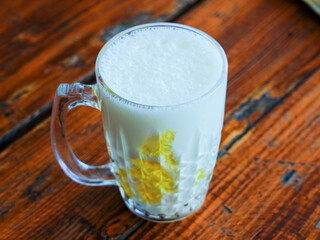 glass of milk shake on wooden table