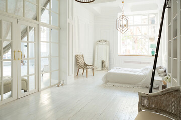 Stylish luxury white bedroom interior design in soft day light with elegant classic furniture