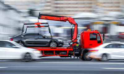 tow truck delivers the damaged vehicle