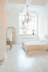 Stylish luxury white bedroom interior design in soft day light with elegant classic furniture