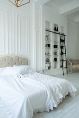 Stylish luxury white bedroom interior design in soft day light with elegant classic furniture