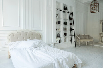 Stylish luxury white bedroom interior design in soft day light with elegant classic furniture