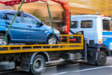 tow truck delivers the damaged vehicle