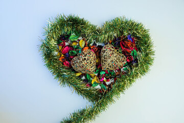 Aromatic potpourri laid out in the shape of a heart. Leaves of potpourri. Aromatic mix of potpourri of dried flowers.