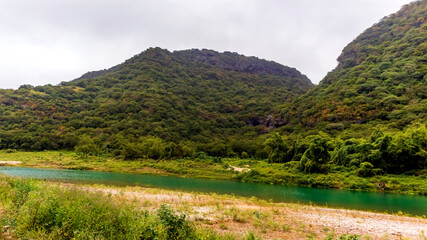 landscape with lake and mountains in salalah