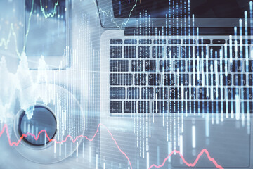 Stock market chart and top view computer on the table background. Multi exposure. Concept of financial analysis.