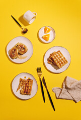 Stack of belgian waffles with pear and honey for breakfast. Delicious homemade pastry.