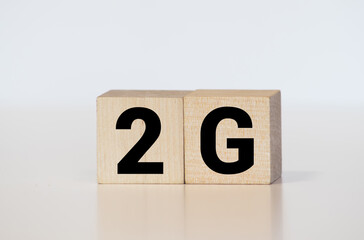 the word of 2G on wooden cubes