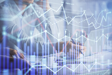 Double exposure of man and woman working together and financial graph hologram. Business concept. Computer background.