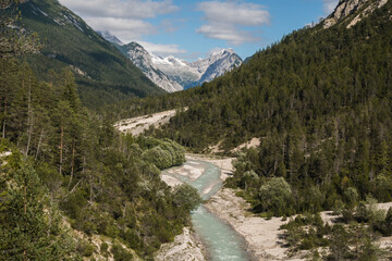 View of the Isar River close to Scharnitz village, austrian Alps, during the summer