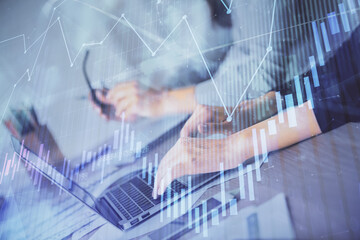 Multi exposure of woman hands typing on computer and financial chart hologram drawing. Stock market analysis concept.