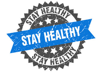 stay healthy stamp. grunge round sign with ribbon