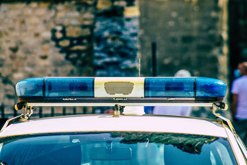 Closeup of an official police car patrolling the streets of the city center of the metropolitan...
