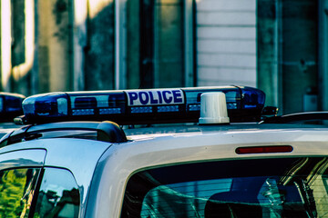 Closeup of an official police car patrolling the streets of the city center of the metropolitan area
