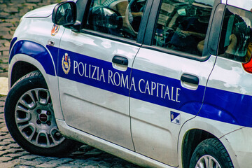 Closeup of an official police car patrolling the streets of the city center of the metropolitan area
