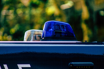 Closeup of an official police car patrolling the streets of the city center of the metropolitan...