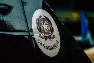 Closeup of an official police car patrolling the streets of the city center of the metropolitan area  © ahinoam