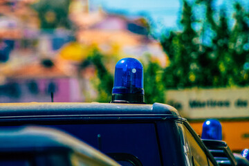 Closeup of an official police car patrolling the streets of the city center of the metropolitan area
